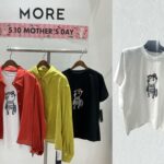 めがねをかけた猫のイラストが描かれたTシャツ